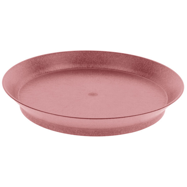 A round pink polypropylene deli server with a short base.