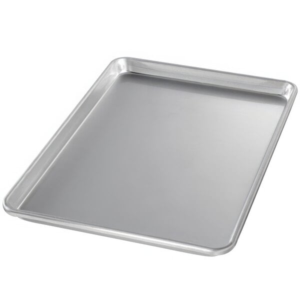 A Chicago Metallic aluminum bun pan with a semi-curled rim on a counter.