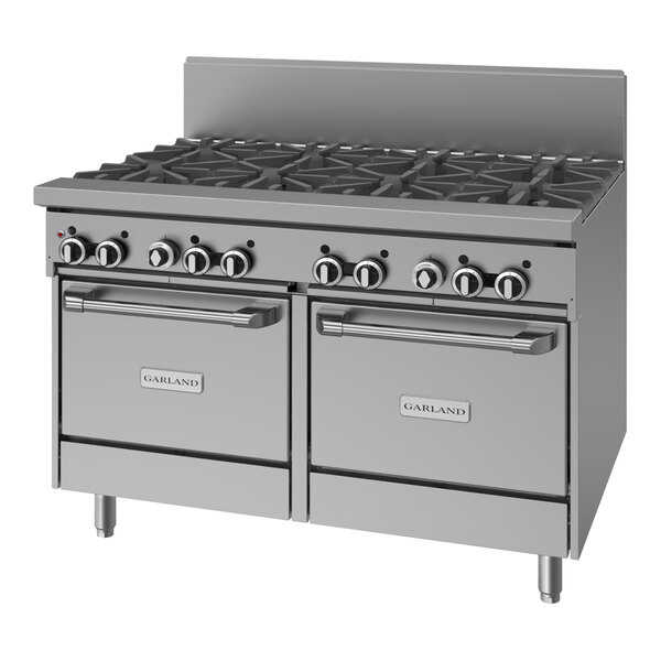 A large stainless steel commercial gas range with eight burners and two ovens.