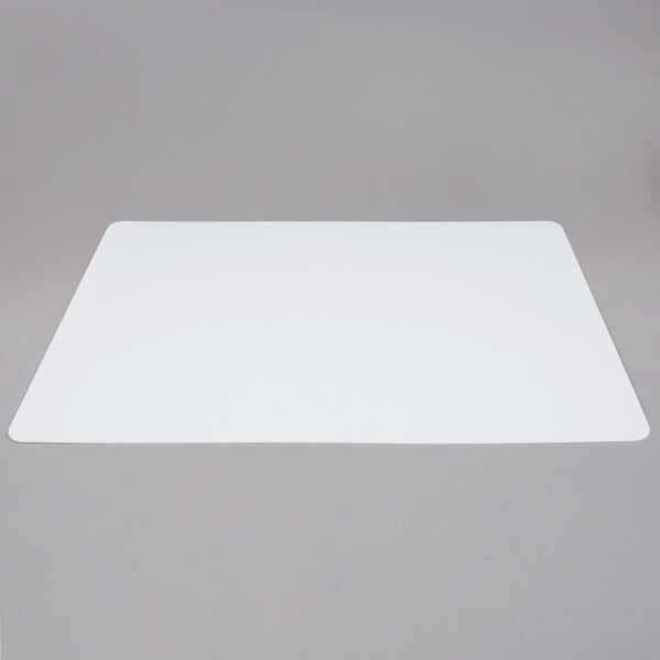 A white rectangular Tablecraft flexible cutting board with a black border.