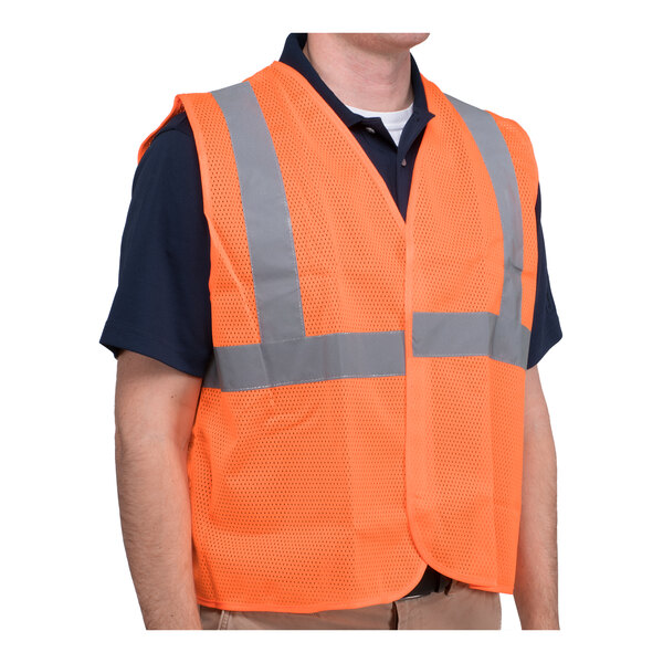 A man wearing a Cordova orange high visibility safety vest with reflective stripes.