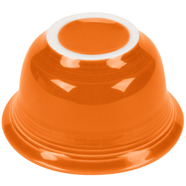 An orange Fiesta china bouillon bowl with a white rim.