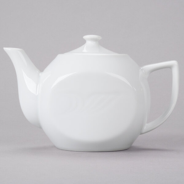 A white CAC porcelain teapot with a lid.