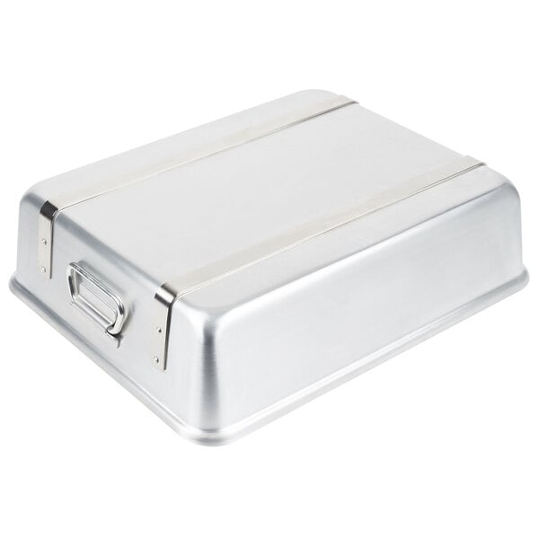 A silver rectangular Vollrath aluminum roaster pan with handles.