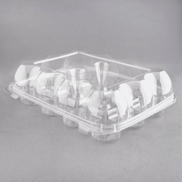 A clear plastic InnoPak cupcake container with 12 compartments and a high dome lid.