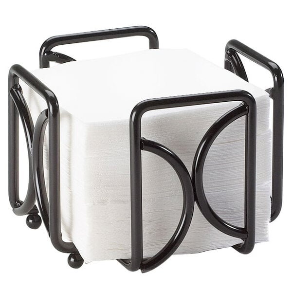 a black metal holder with a stack of napkins