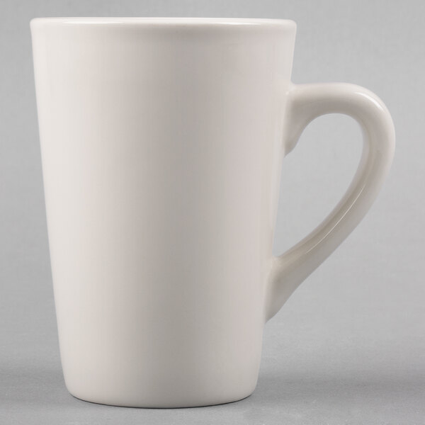 A Tuxton white china mug with a handle.