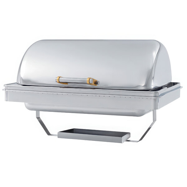 A silver Vollrath rectangular chafer with brass trim and a yellow handle on a counter.