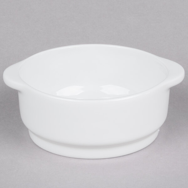 A white Arcoroc porcelain soup bowl with a handle.