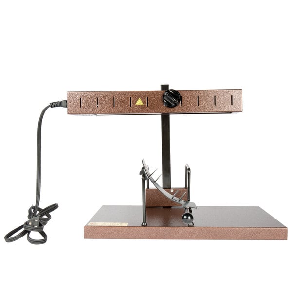 A brown metal stand with a wire attached to a small lamp.