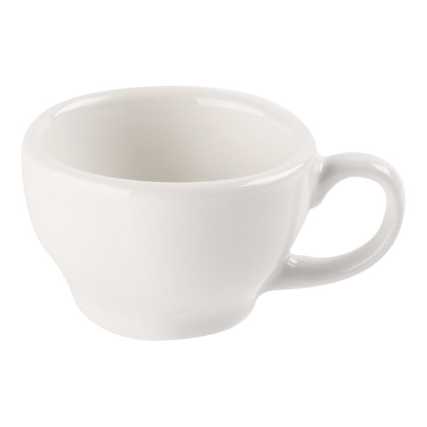A small, white porcelain coffee cup with a handle, shown against a plain background.