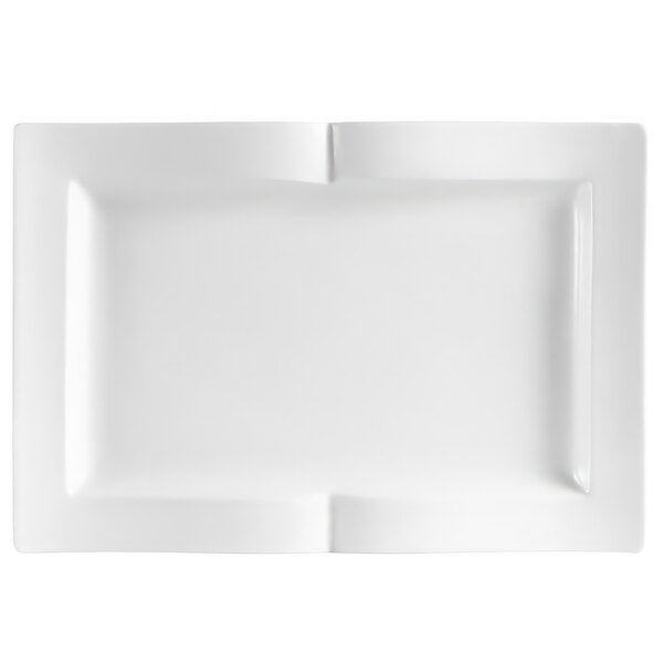 A white rectangular china platter with curled edges and a small cut out shaped like a book.