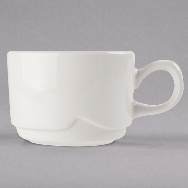 A Libbey ivory porcelain medium stacking cup with a handle.