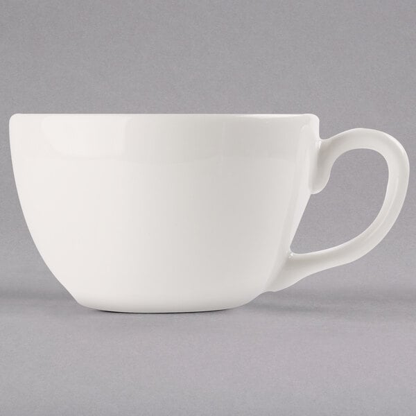 A Libbey ivory porcelain coffee cup with a handle.