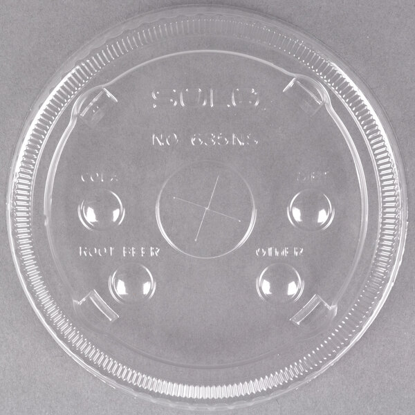 A Solo clear plastic lid with identification buttons and a straw slot.