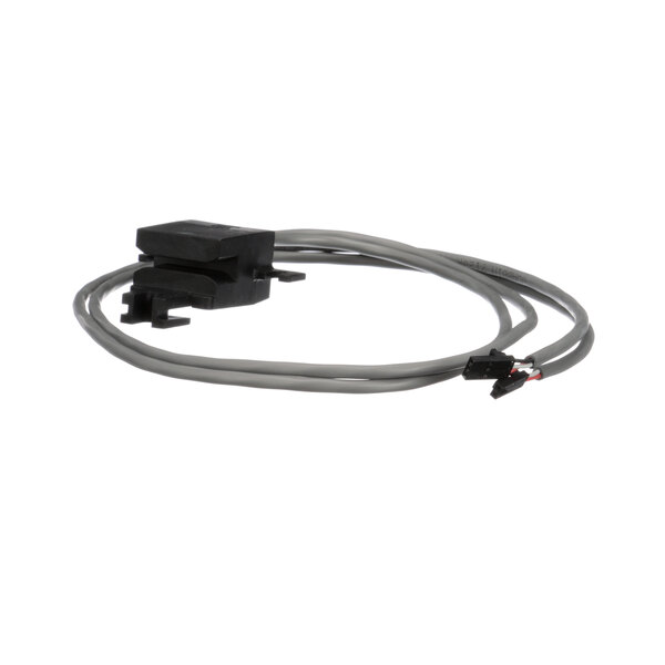 A close-up of a cable with a connector on a Manitowoc Ice Hall Effect Switch.
