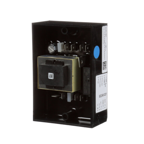 A close-up of a black box with a square object inside.