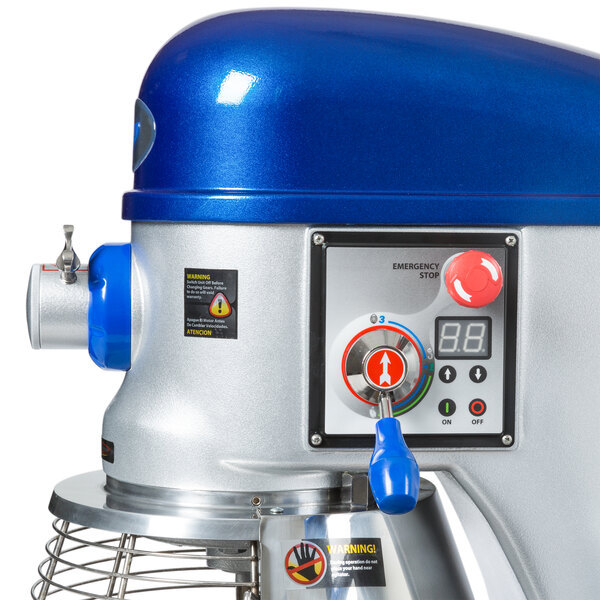 A blue and silver Vollrath 40 quart floor mixer with a white and blue guard.