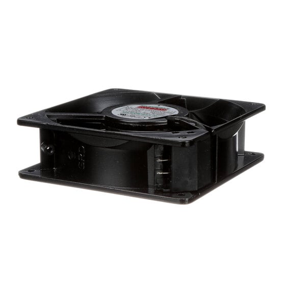 A black plastic fan with a round metal disc and a white circle on it.