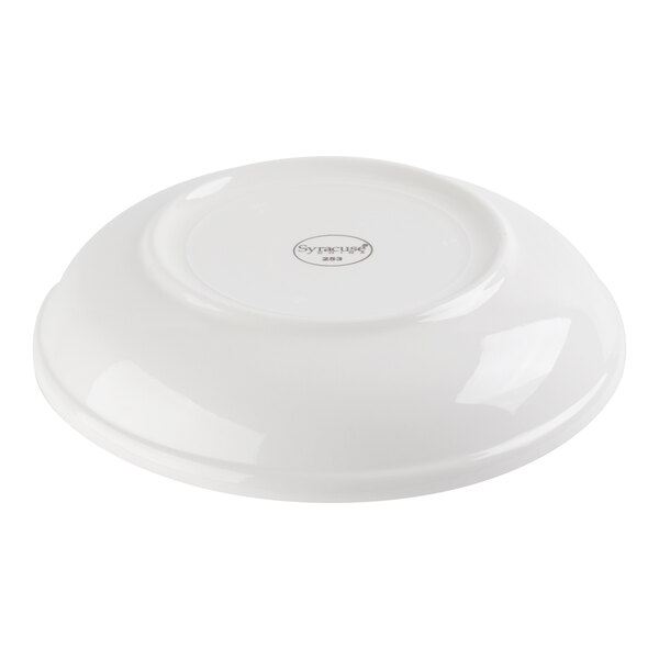 A white, shallow bowl shown upside down with a small circular logo at the center.