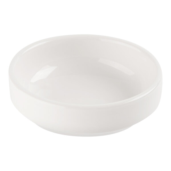 A small, round, white porcelain dish with smooth sides and a glossy finish.