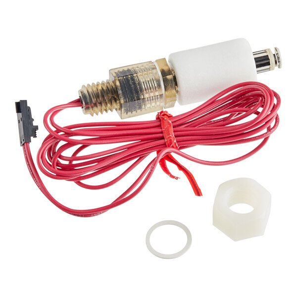 A close-up of a Manitowoc Ice level switch with a red and white wire and connectors.