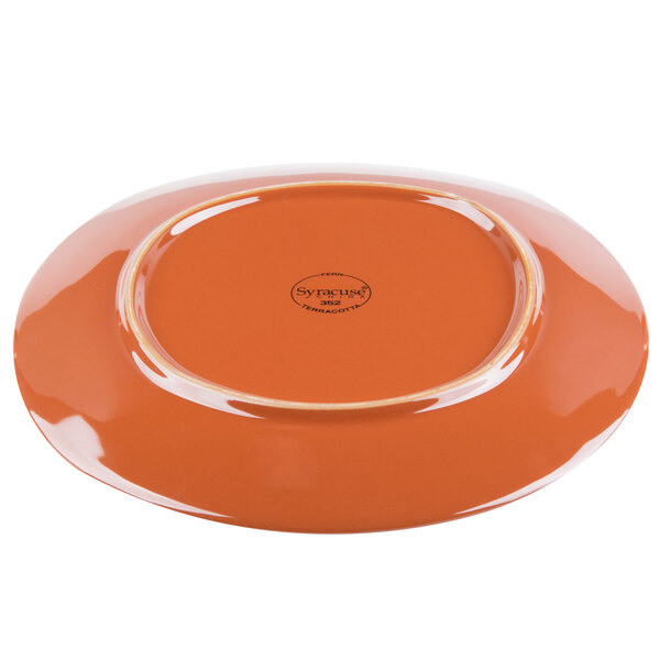 A close-up of a Libbey terracotta fern green stoneware plate.