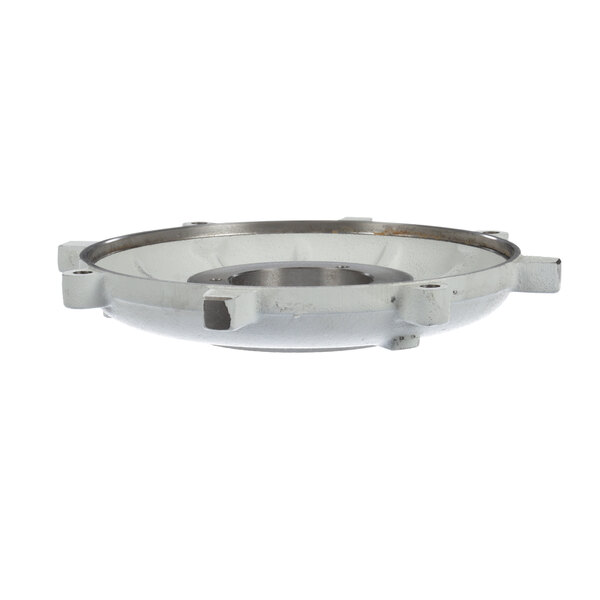 A white metal lower bearing bracket with a round metal object.