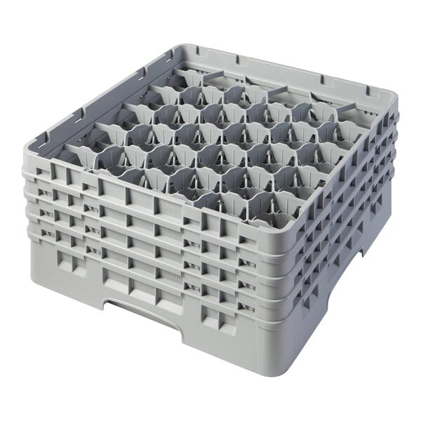 A grey plastic crate with many small compartments and holes.