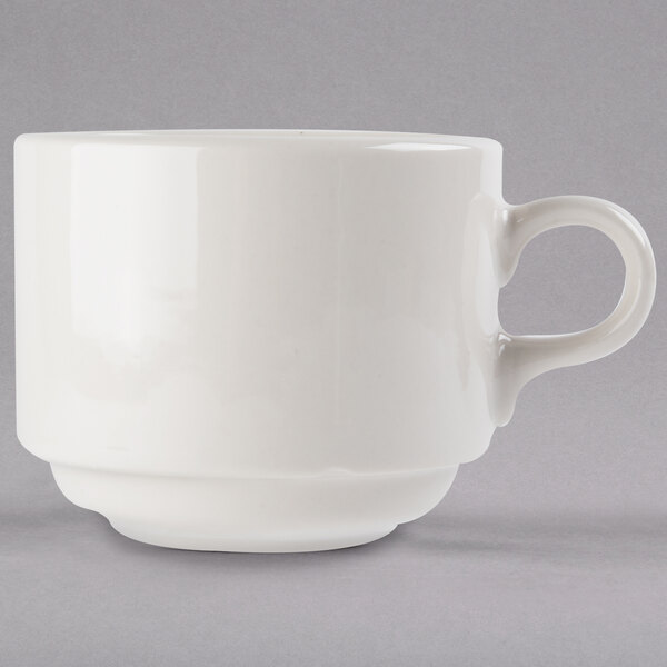 A white porcelain Libbey tea cup with a handle.
