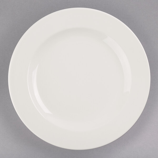 A Libbey ivory porcelain plate with a white rim on a white background.