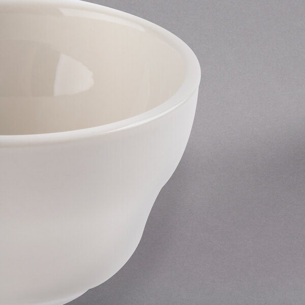 A Libbey St. Francis ivory porcelain bouillon cup with a handle.