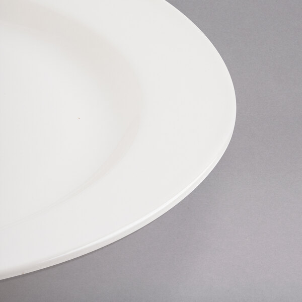 A close-up of a Libbey ivory porcelain plate with a white rim.