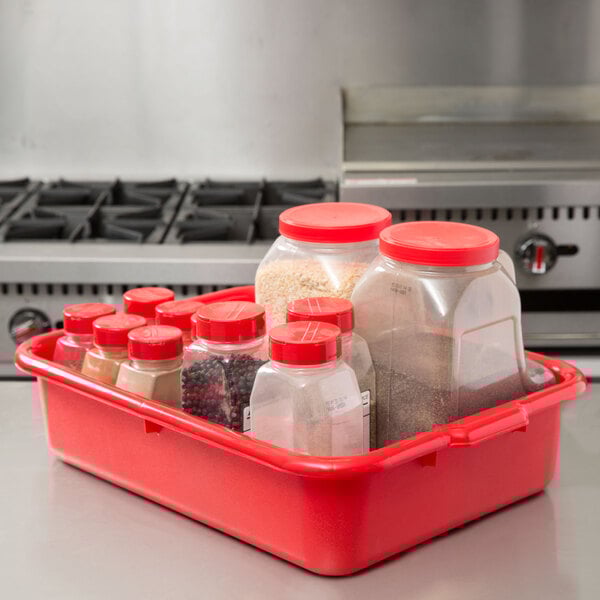 A red Tablecraft plastic bus tub with a red lid.