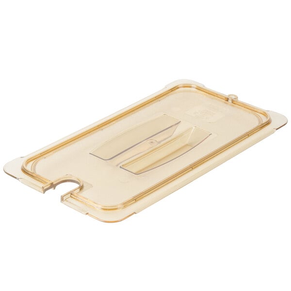 A Carlisle amber plastic lid with a handle and spoon notch.