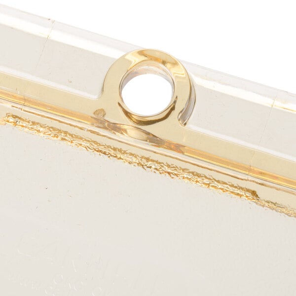 A close up of a Carlisle Amber plastic case with a gold ring on it.