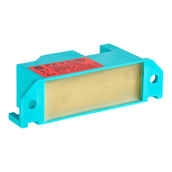 A blue rectangular US Range spark generator with a red label.