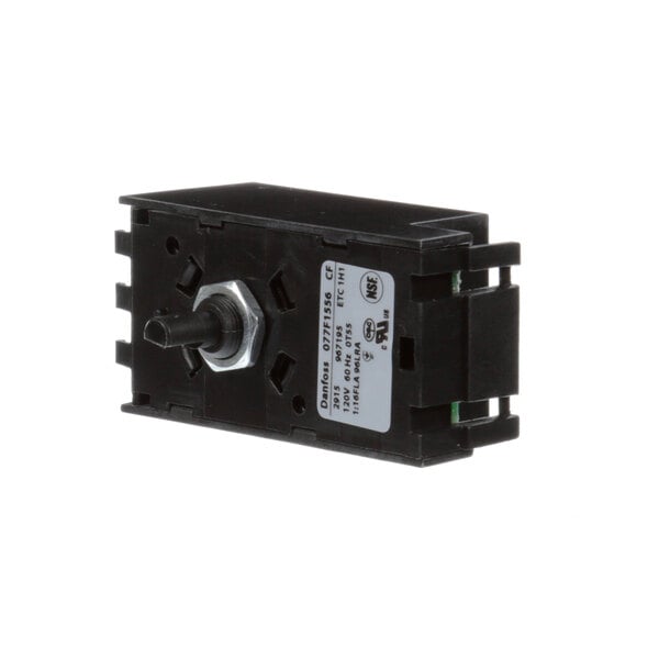 A black plastic device with a metal knob on a white background.