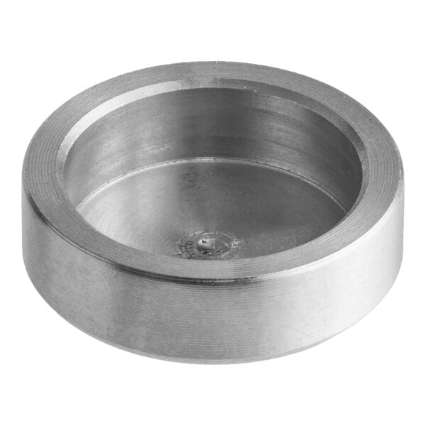 A round, shallow, metallic holder with smooth sides and a flat bottom.