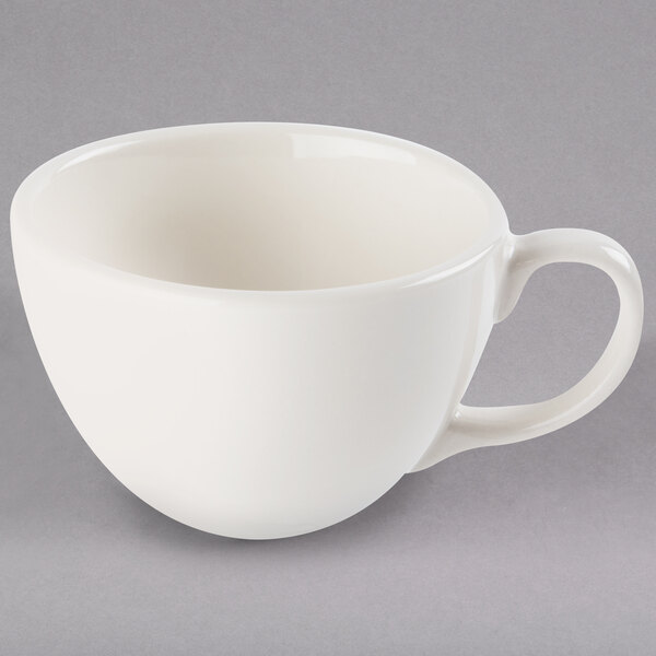 a white cup with handle