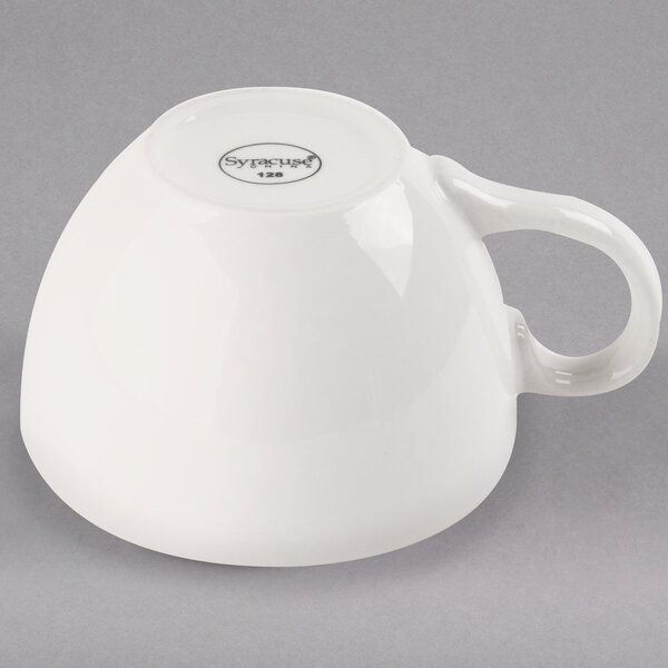 A Libbey ivory porcelain coffee cup with a handle.