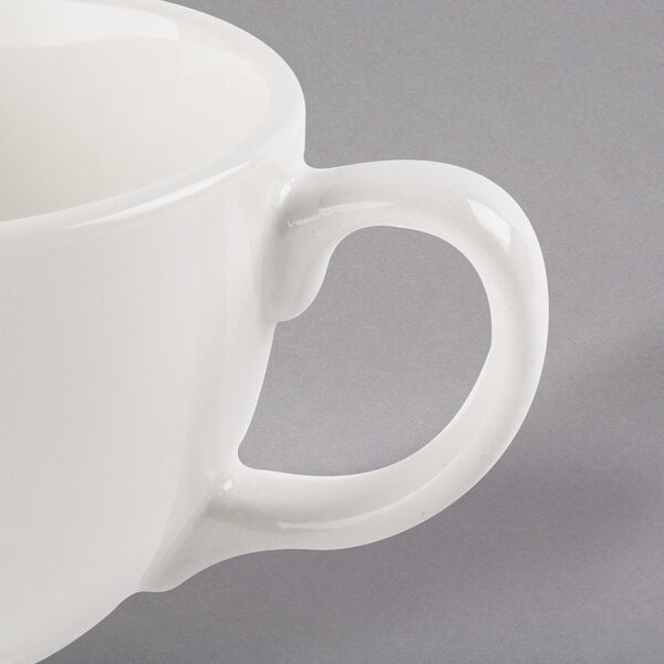 A white Libbey porcelain coffee cup with a handle.