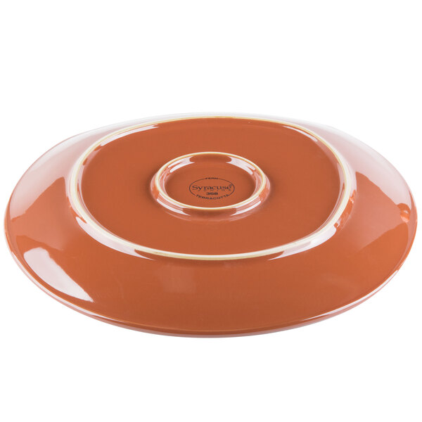 A brown plate with a white rim.