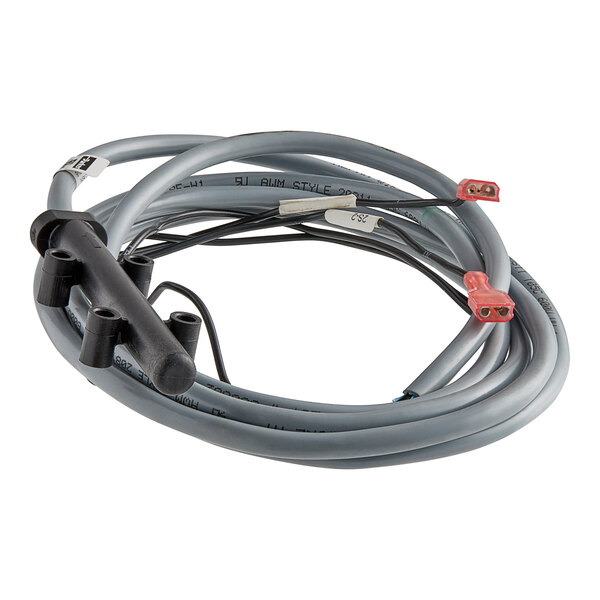 A close-up of a wire with red and black connectors on the end.