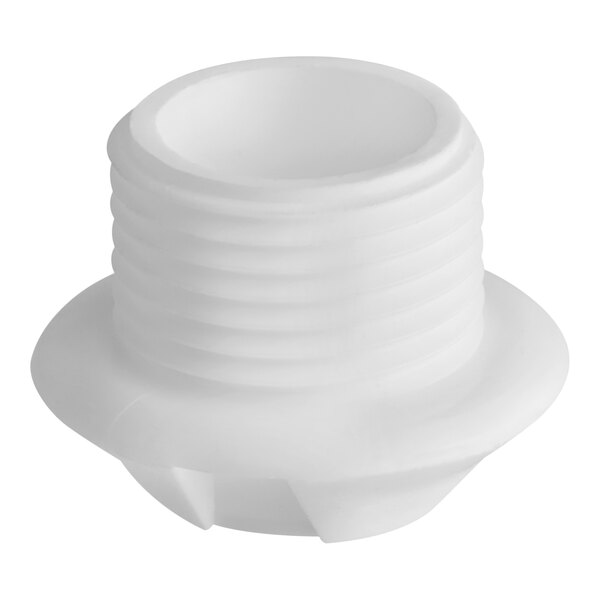 A close up of a white plastic nut with a hole.