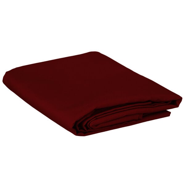 A folded burgundy rectangular table cover.
