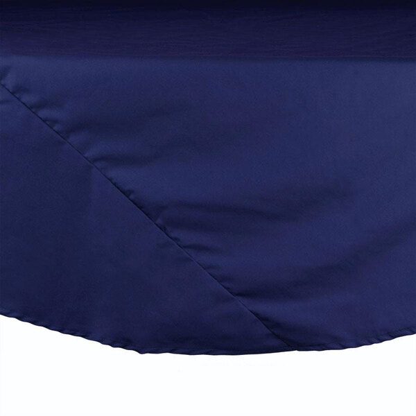 A navy blue Intedge round table cloth on a table.