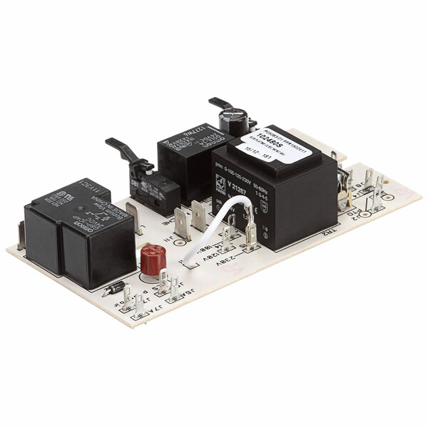 A close-up of a Robot Coupe Control Board with two electronic components.