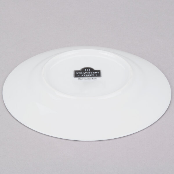 A white porcelain plate with a black logo on it.