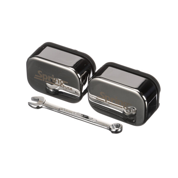 A close-up of a pair of metal Spring USA hinge sets.